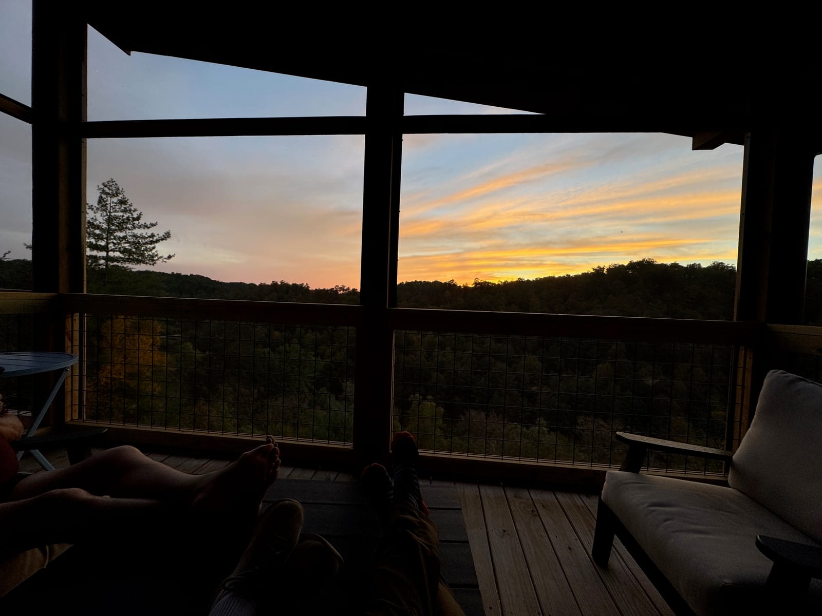 Screened porch looking west over the gorge at dusk